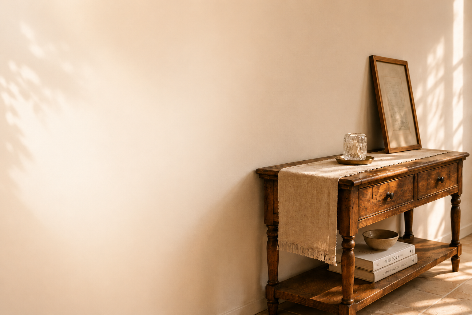 A softly lit wooden table with quiet keepsake objects